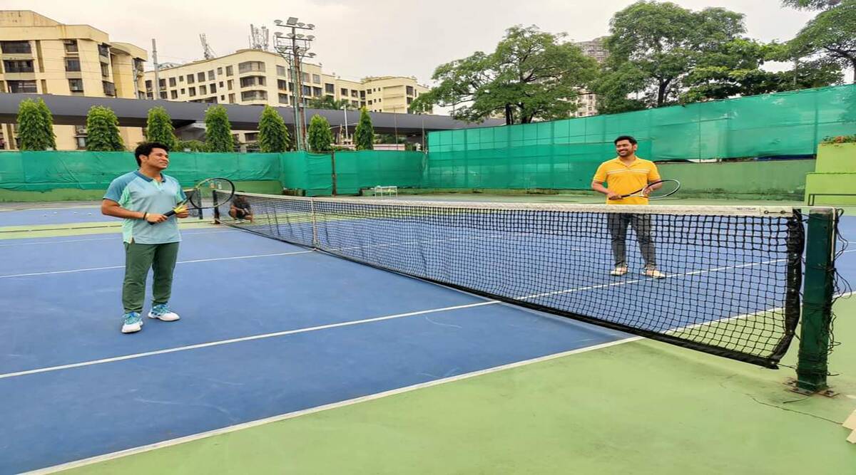 In a photo that went viral on social media, Sachin and Dhoni are seen playing on a tennis court.